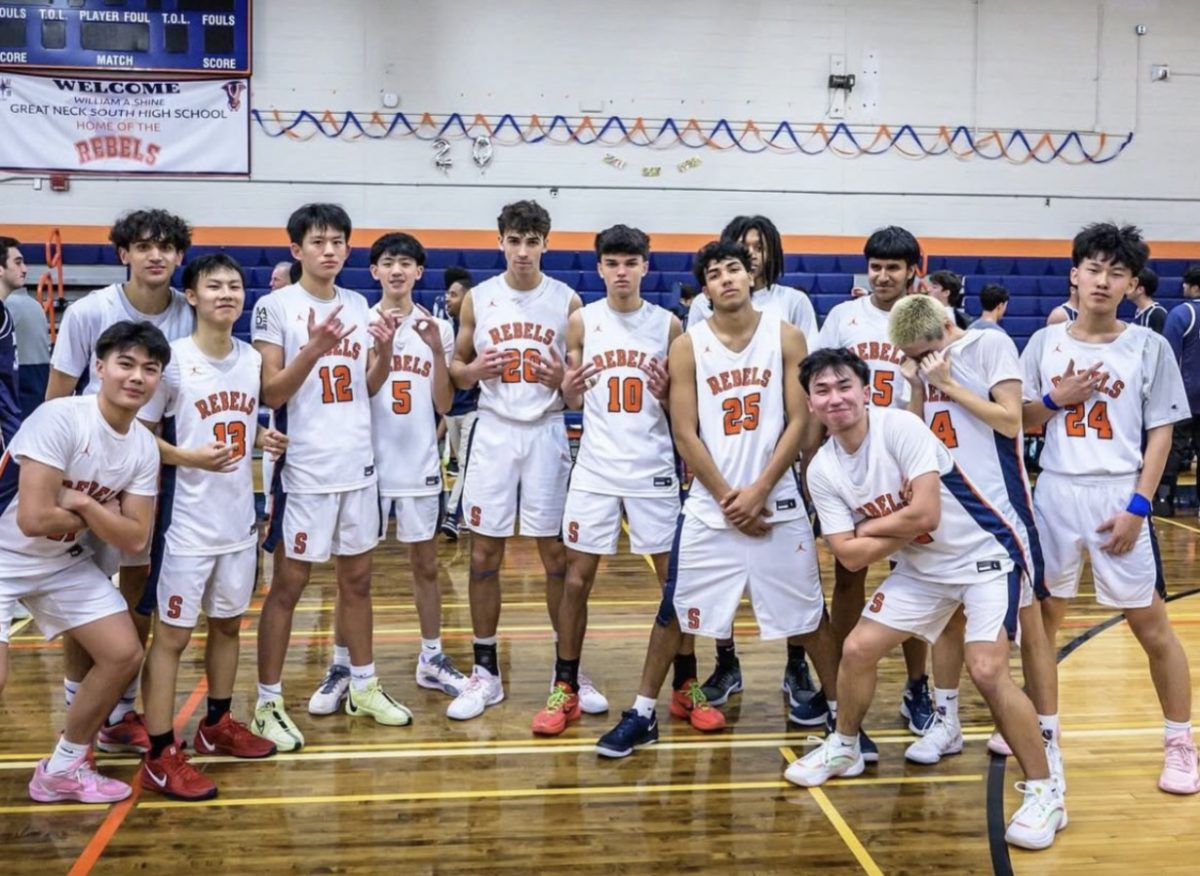 Rebels Triumph Over Rivals in Statement Victory—Senior captain Jesse Roggendorf celebrates the milestone of scoring 1,000 points after beating cross-town rival Great Neck North.
Photo by Mateo Guevara

